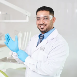 Friendly general dentist near me in Newark preparing for patient care